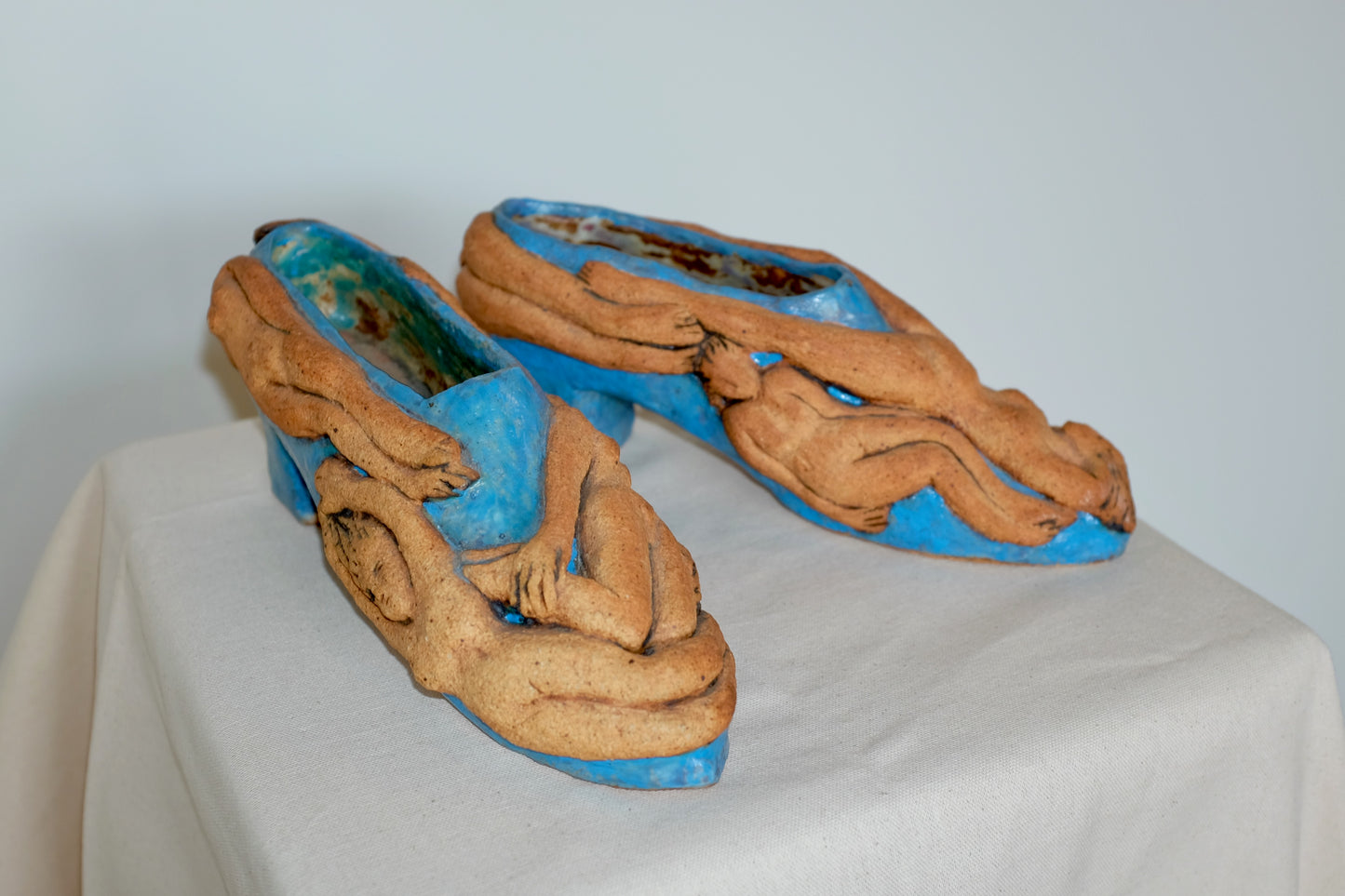 Ceramic Shoes Covered in Nude Figures