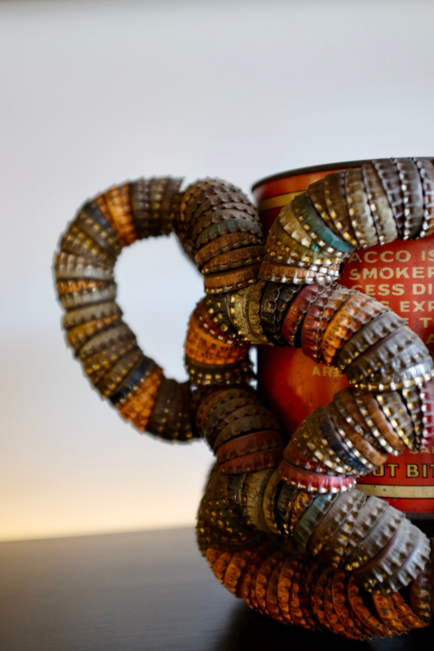Folk Art Bottlecap Basket Over Red Can