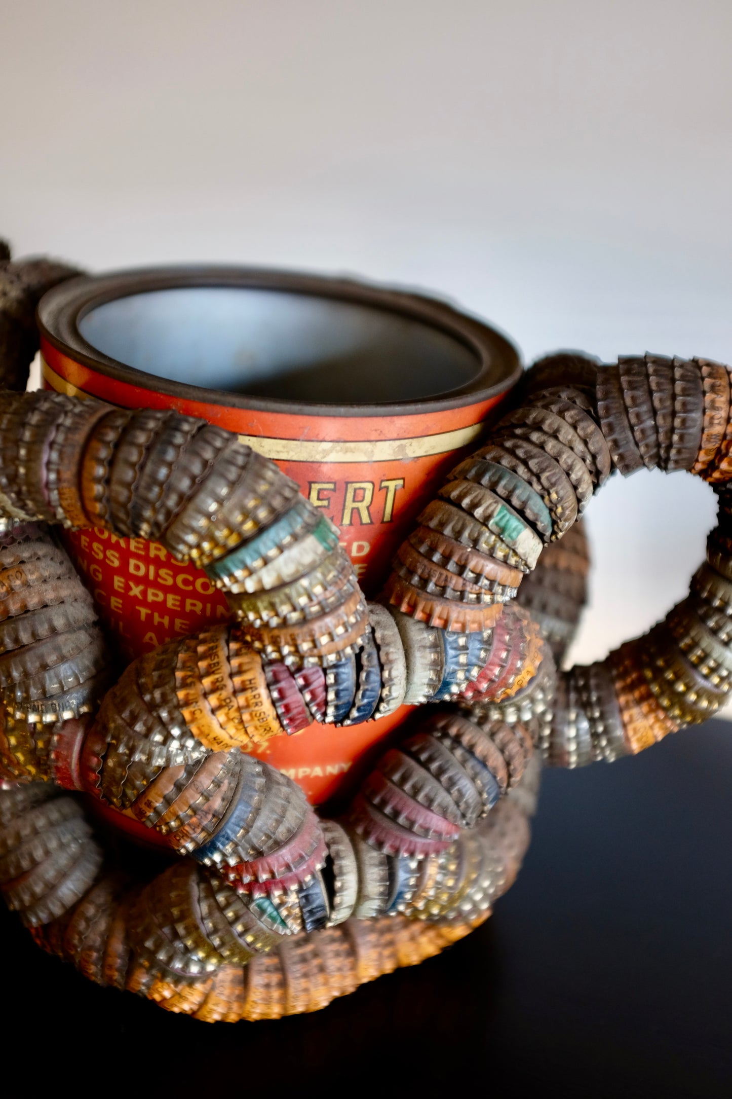 Folk Art Bottlecap Basket Over Red Can