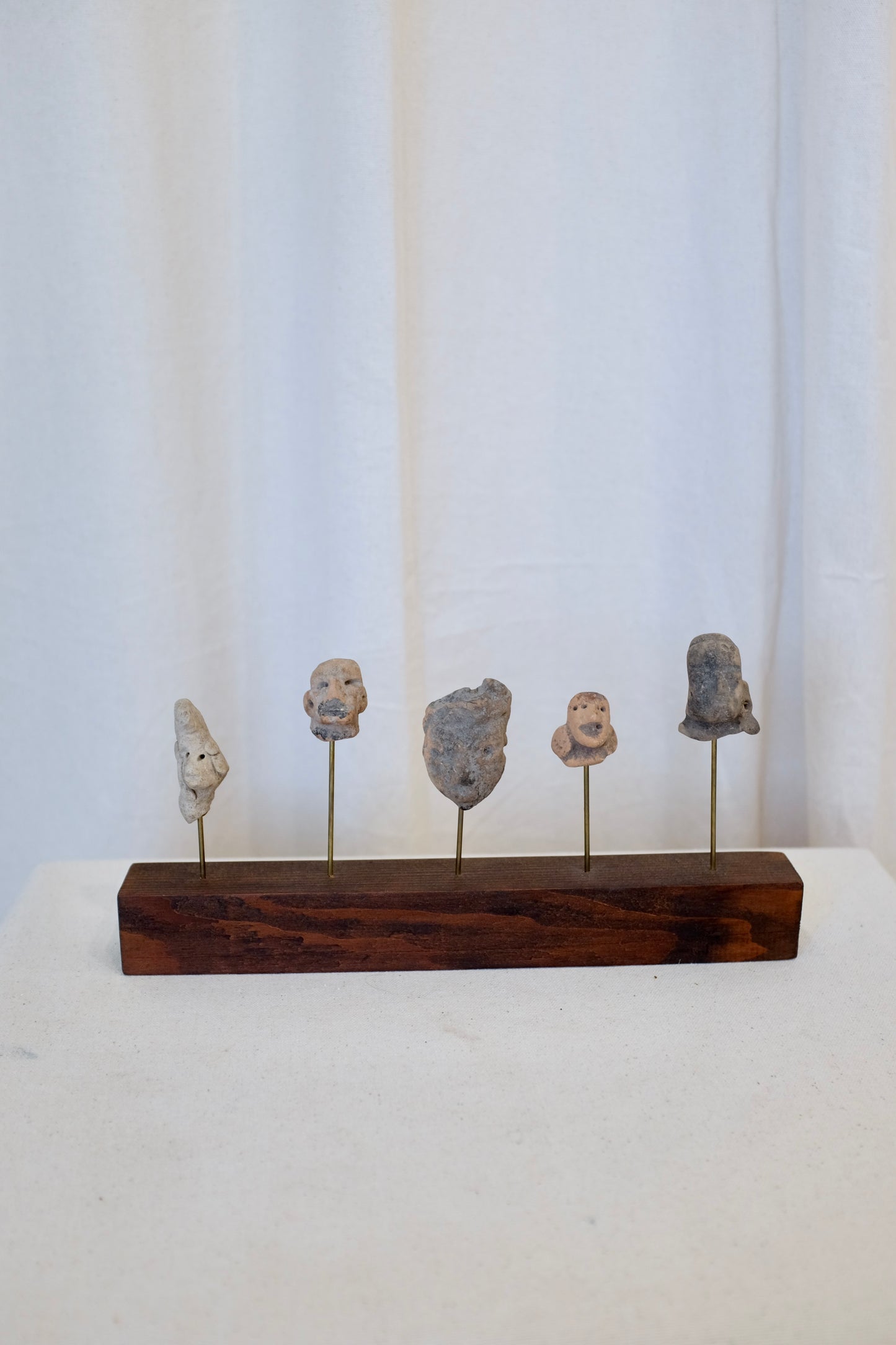 5 Latin American Effigy Heads on Wood Stand