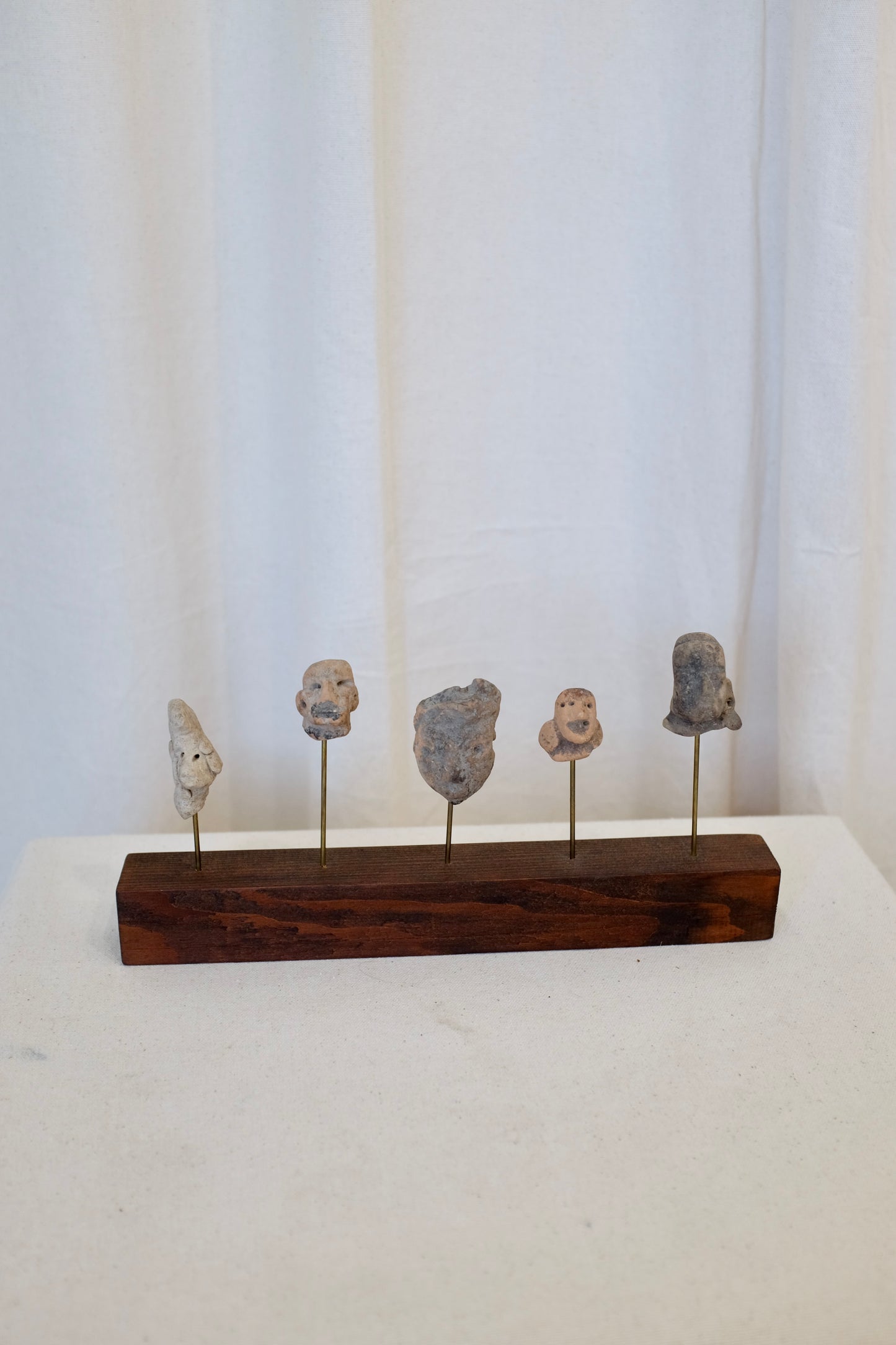 5 Latin American Effigy Heads on Wood Stand