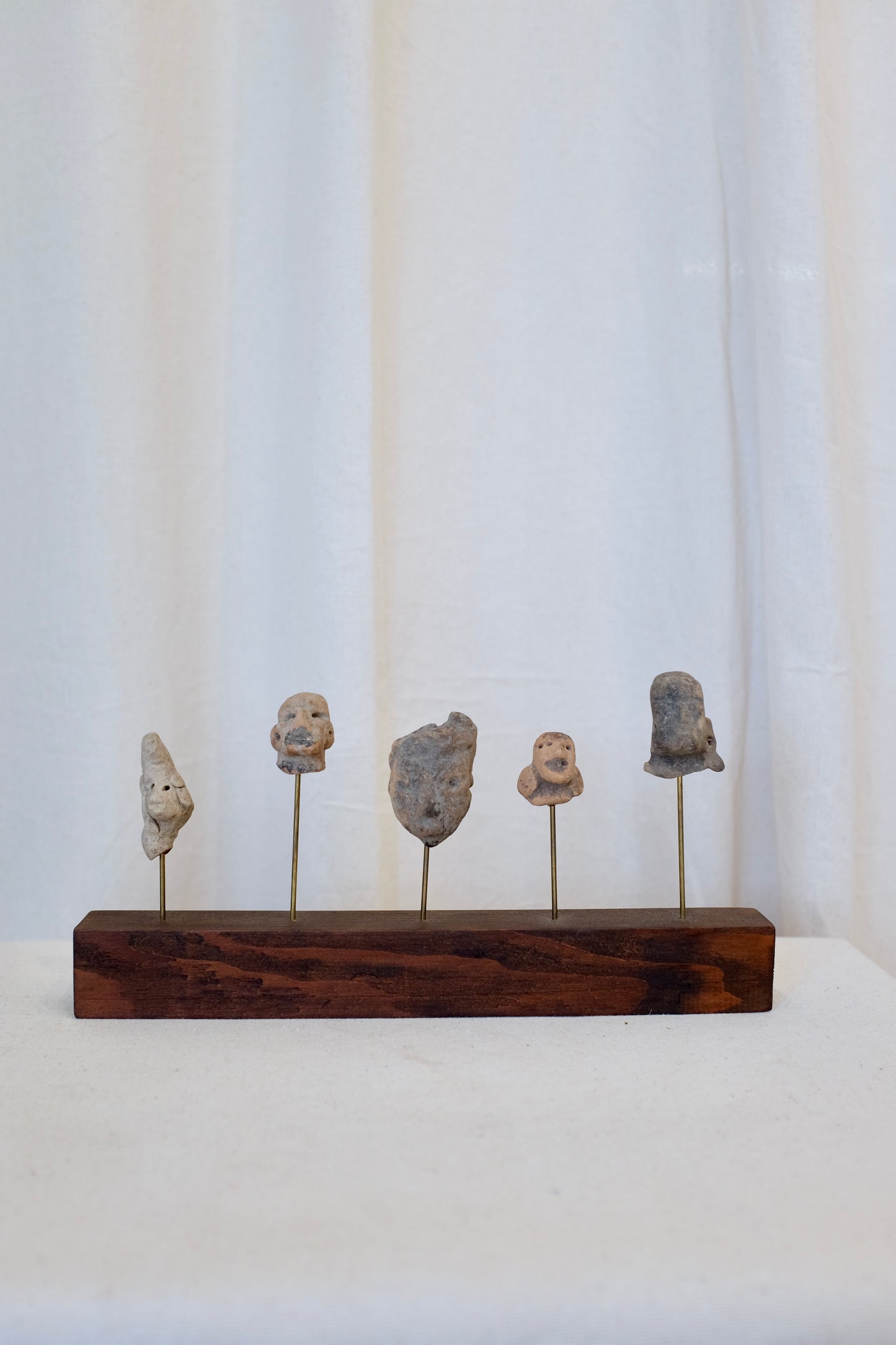 5 Latin American Effigy Heads on Wood Stand
