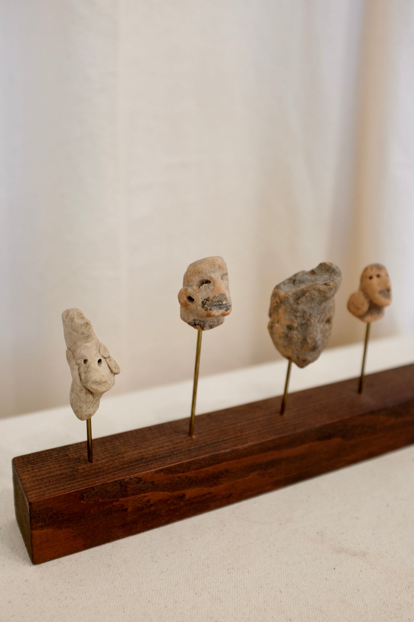 5 Latin American Effigy Heads on Wood Stand