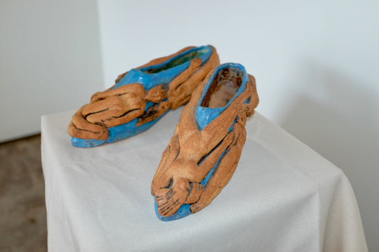 Ceramic Shoes Covered in Nude Figures