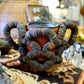 Folk Art Bottlecap Basket Over Red Can