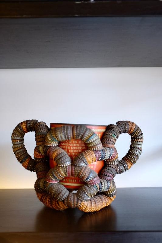 Folk Art Bottlecap Basket Over Red Can