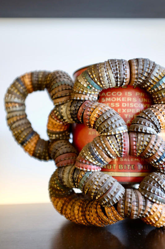 Folk Art Bottlecap Basket Over Red Can