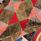 Log Cabin Quilt with Pink, Green, and Red