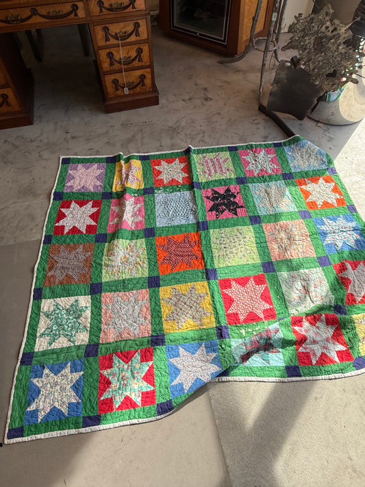 Star Pattern Quilt with Green Base