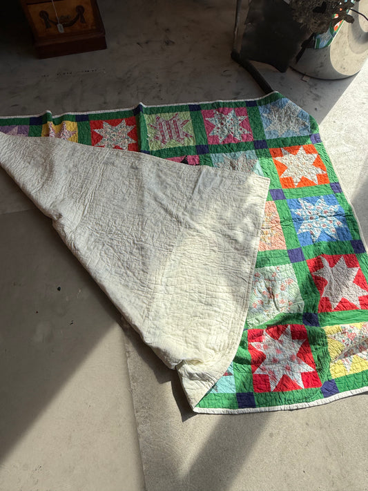 Star Pattern Quilt with Green Base